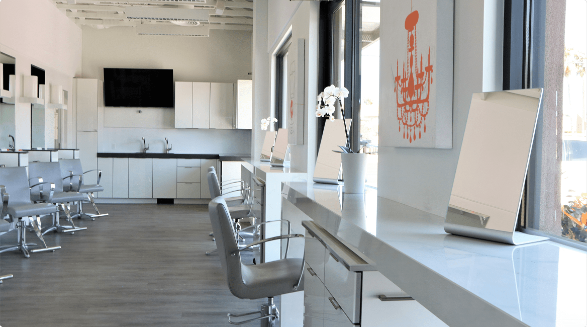 Bright salon interior with mirrors and chairs