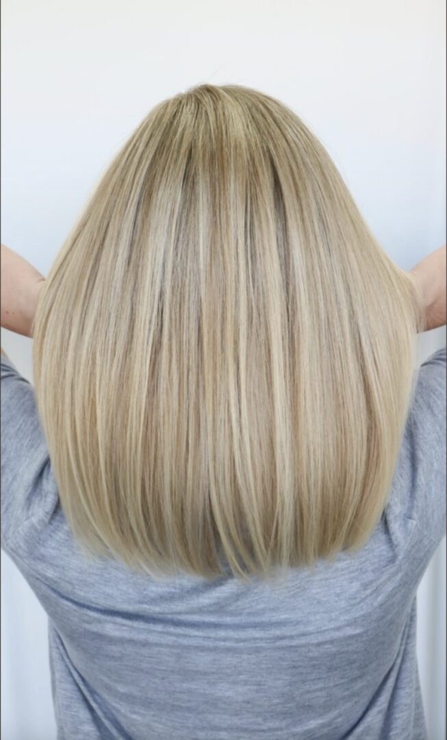 Smooth, straight blonde hair with a soft shine.