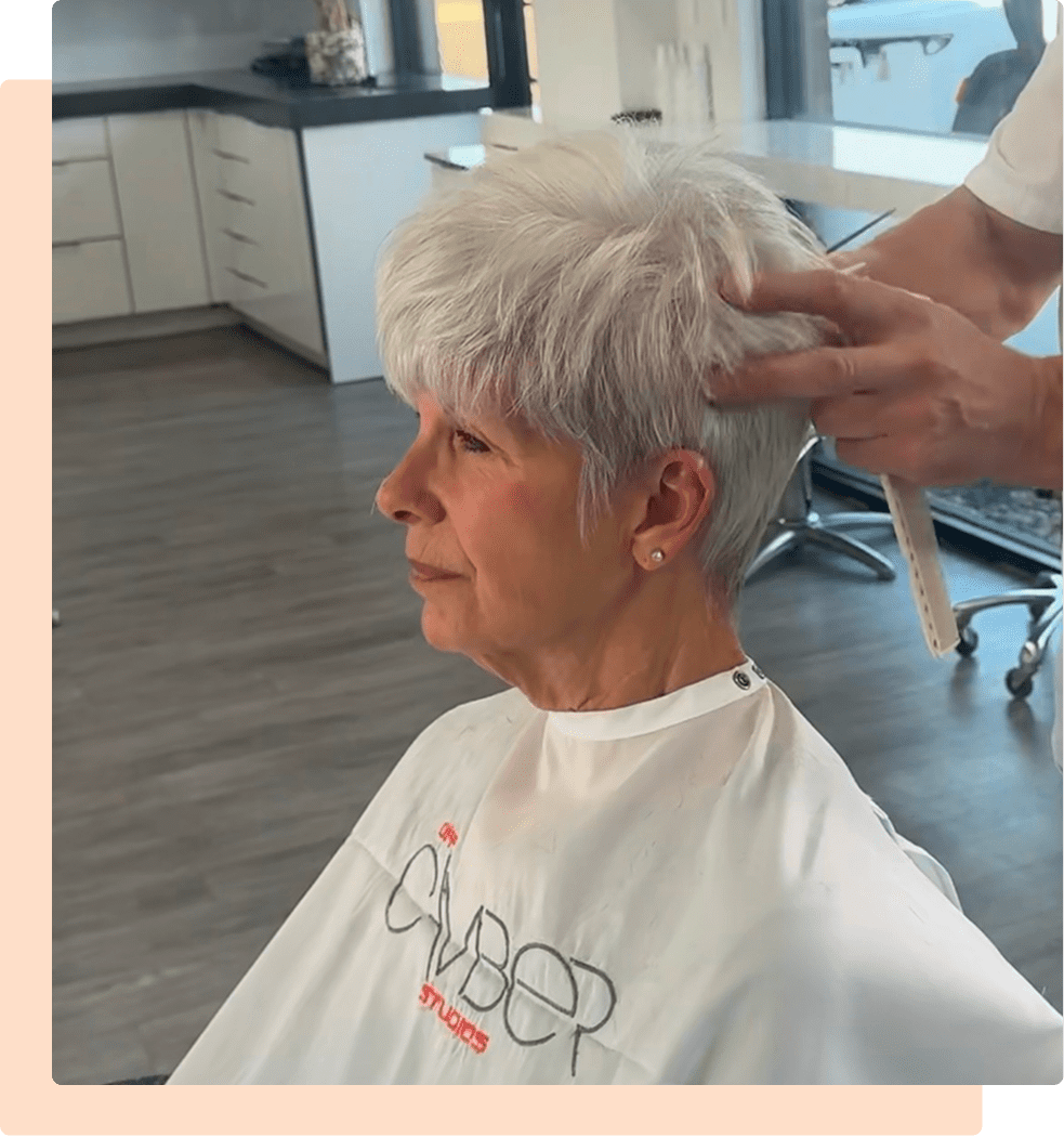 Senior woman with short silver hair at salon