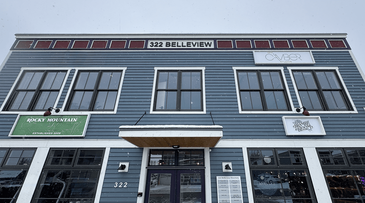 Blue two-story commercial building at 322 Belleview