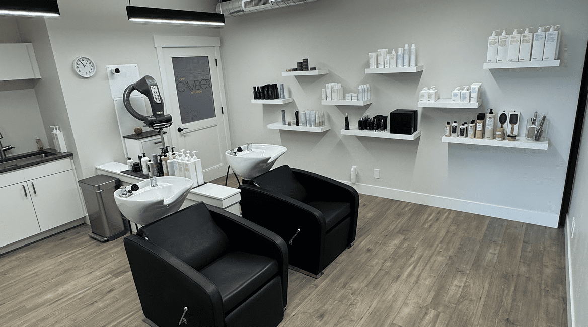 Hair salon shampoo stations with product shelves